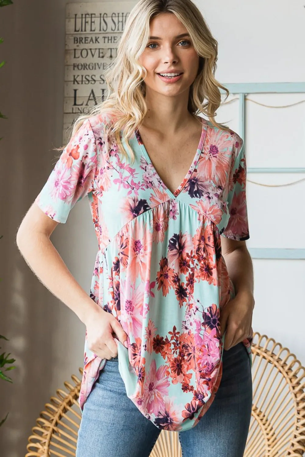 Mint floral babydoll top styled with jeans