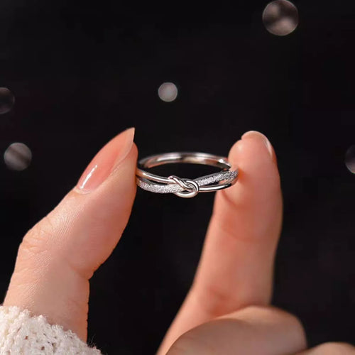 Silver love knot ring angled detail view