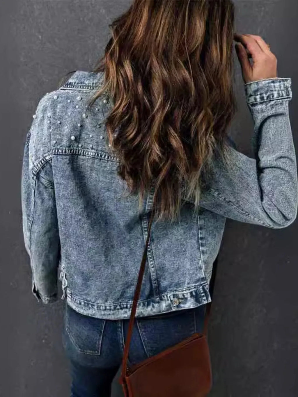 Denim jacket back view showing washed finish