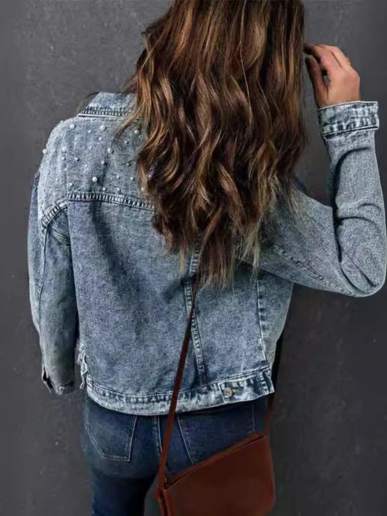 Denim jacket back view showing washed finish