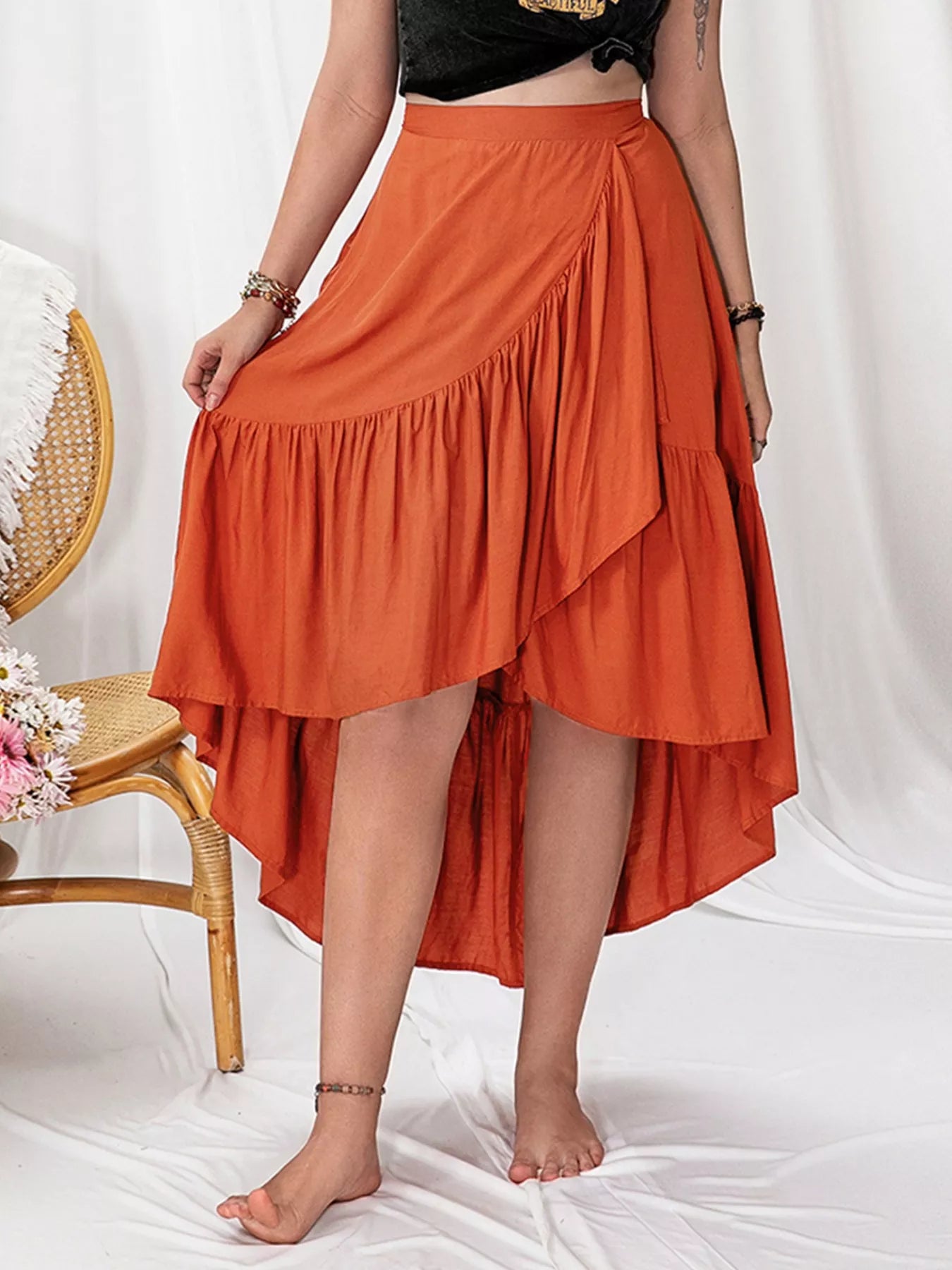 Orange high low skirt showing ruffled hem