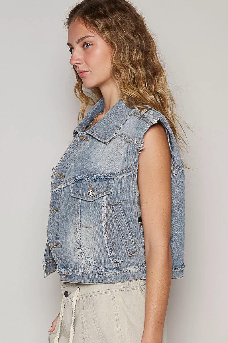 Denim vest distressed detail close up