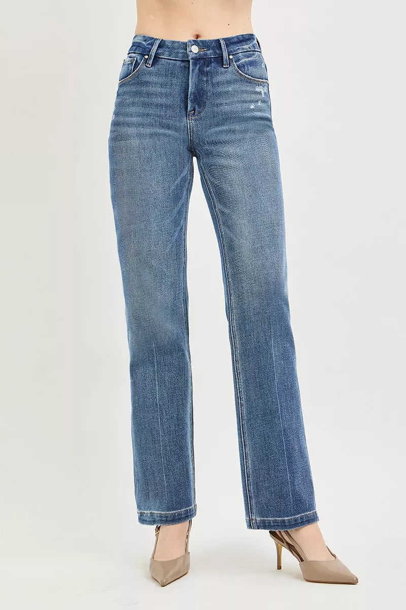 Woman wearing RISEN straight leg jeans with crease line detail