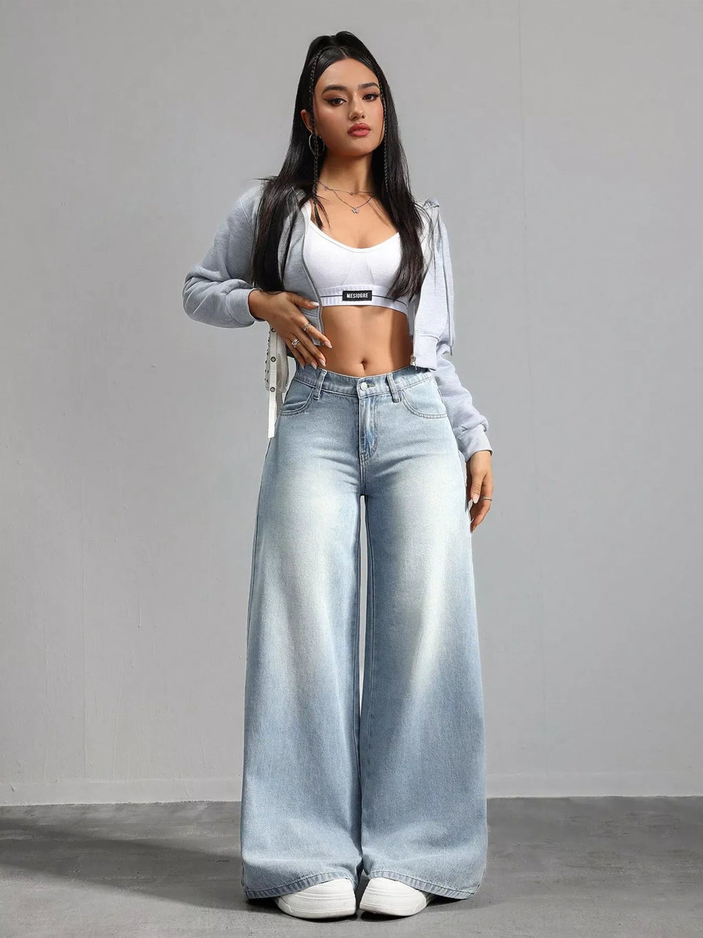 High waisted light blue jeans back view
