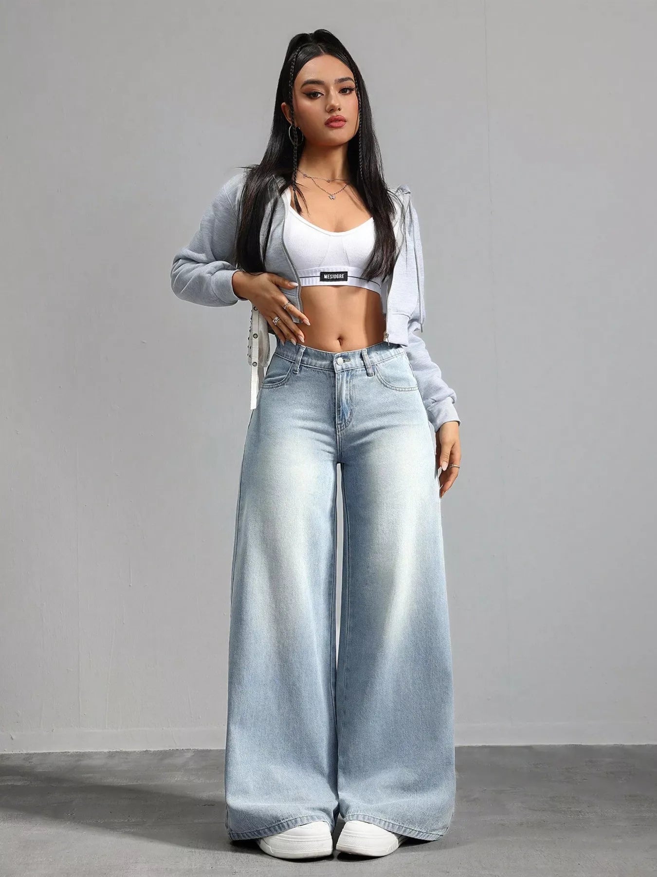 High waisted light blue jeans back view