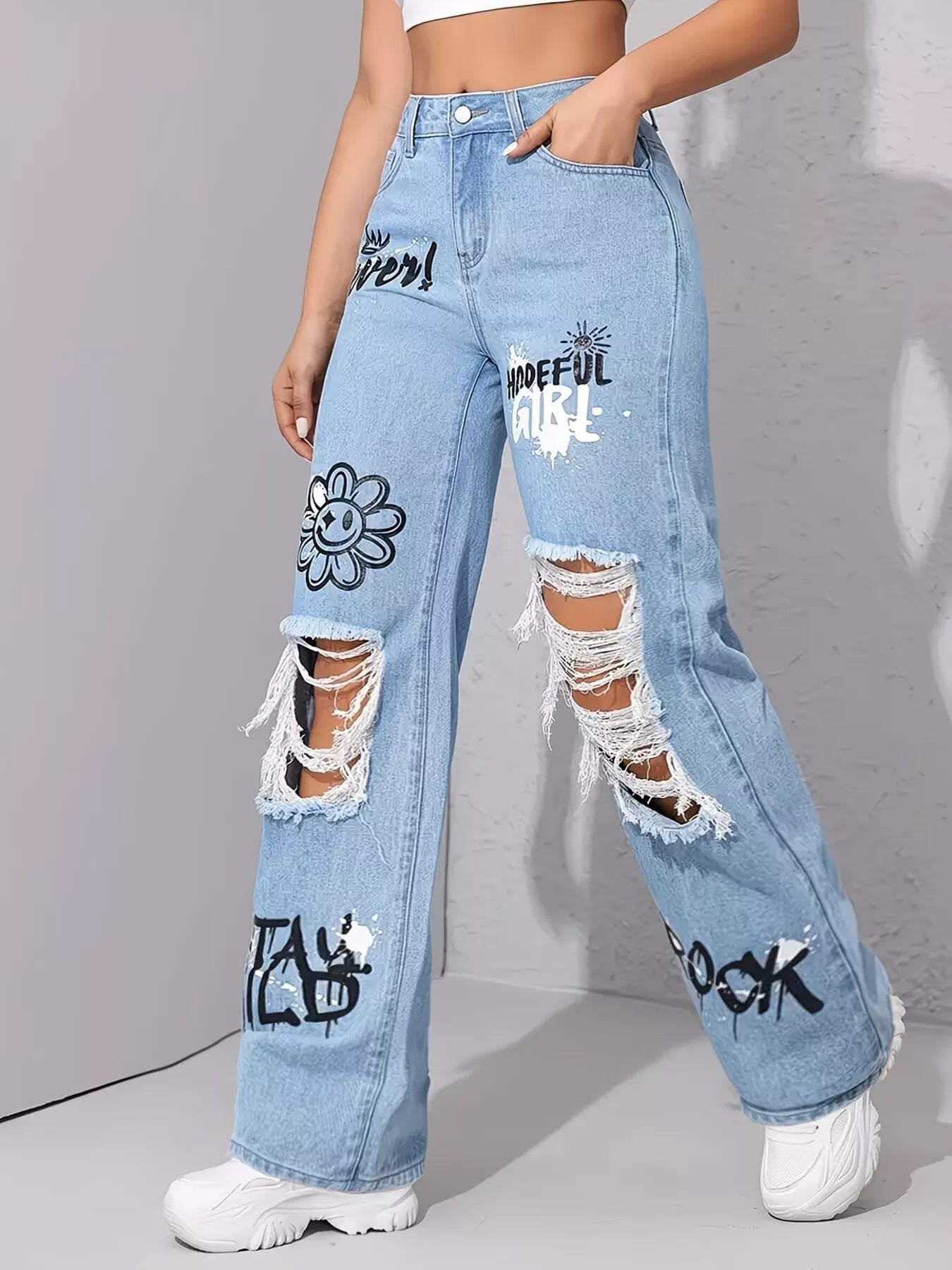 Graffiti distressed wide leg jeans in light blue front view