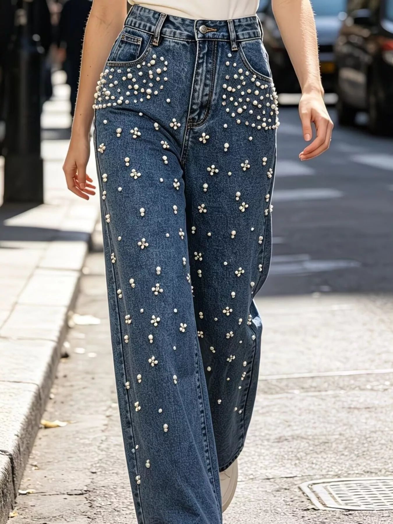 Sparkling rhinestone embellishment on denim fabric