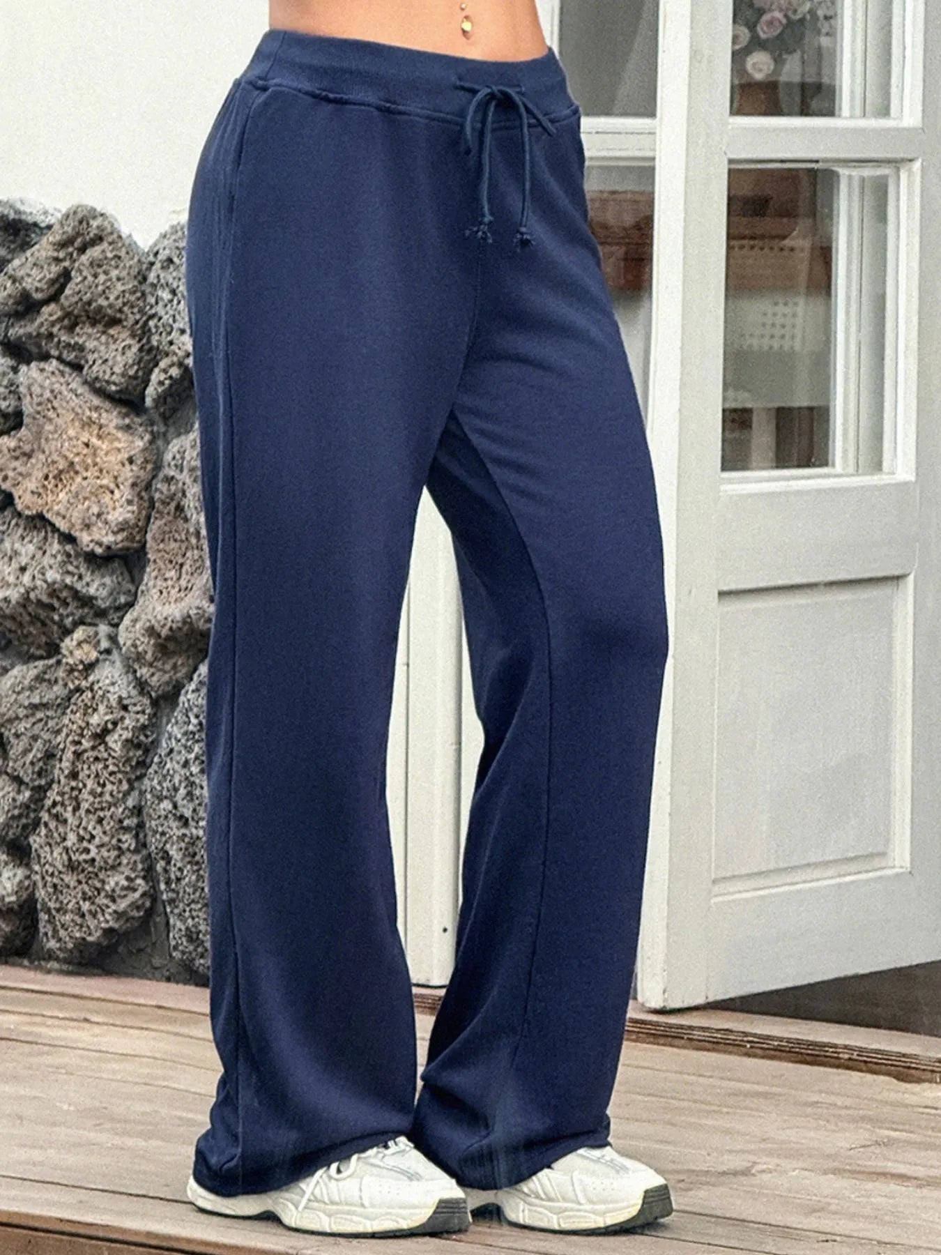 Navy drawstring wide leg active pants front view on model