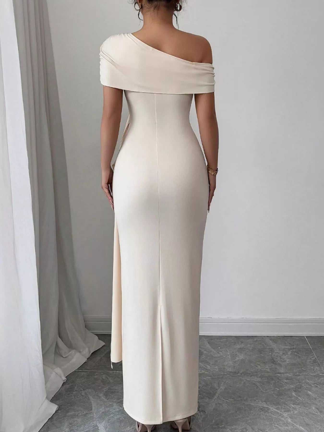 Ruched maxi dress side view showing one shoulder neckline