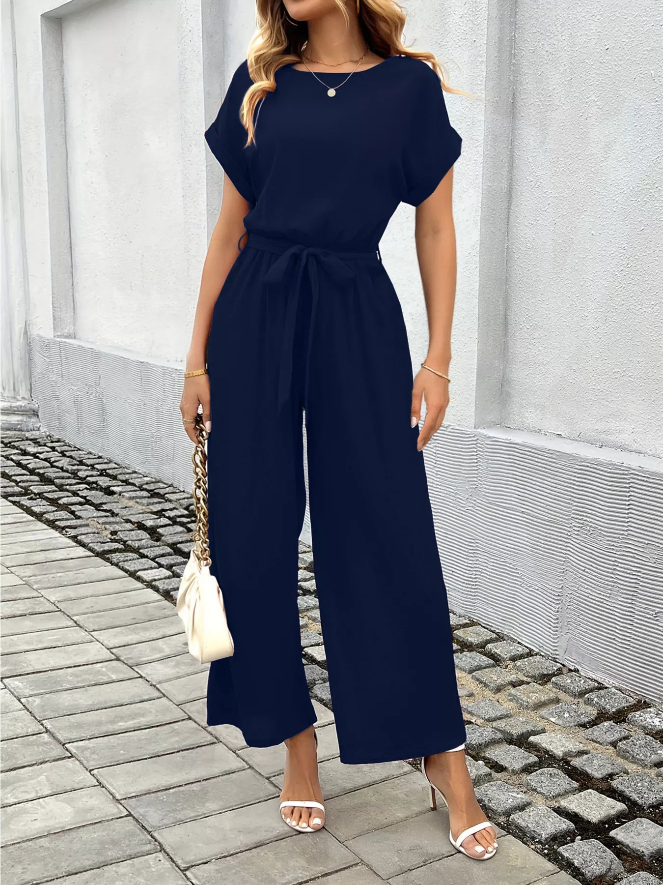 Close up of tie waist detail on jumpsuit