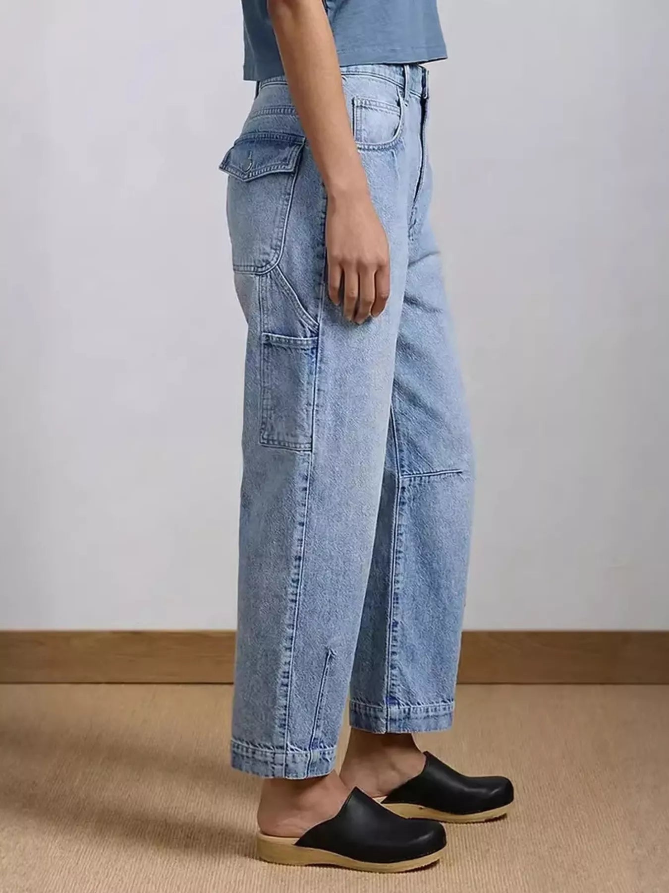 Washed blue wide leg jeans back view showing pockets