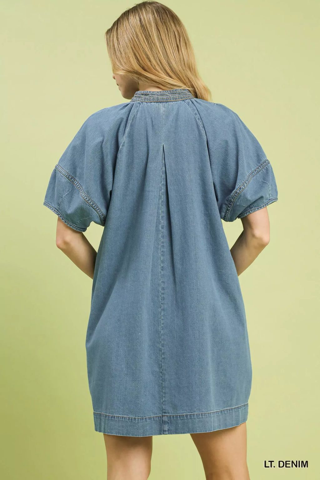 A line denim mini dress side view on model