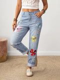 Flower embroidered distressed jeans in dusty blue front view