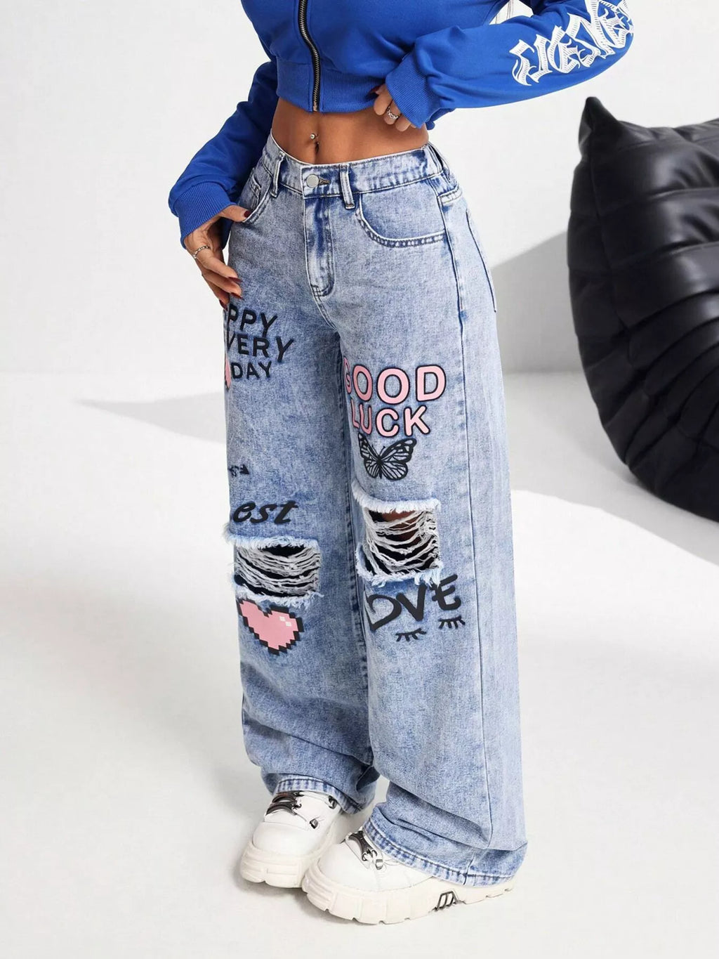 Graffiti print ripped wide leg jeans front view