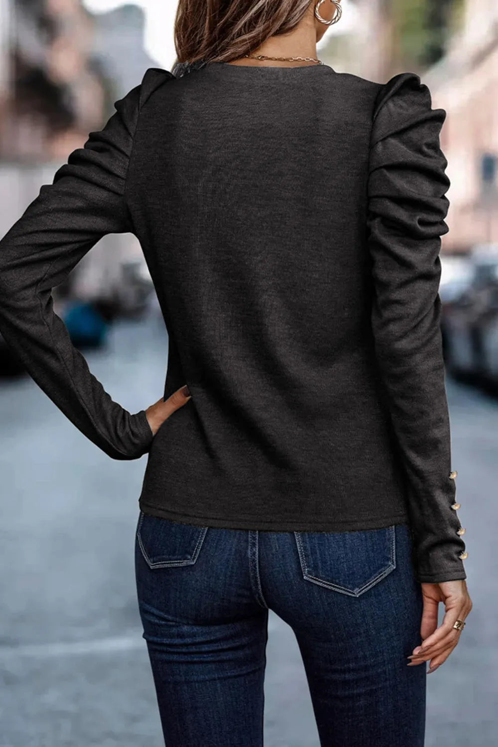 Close up of puff sleeve blouse fabric and neckline