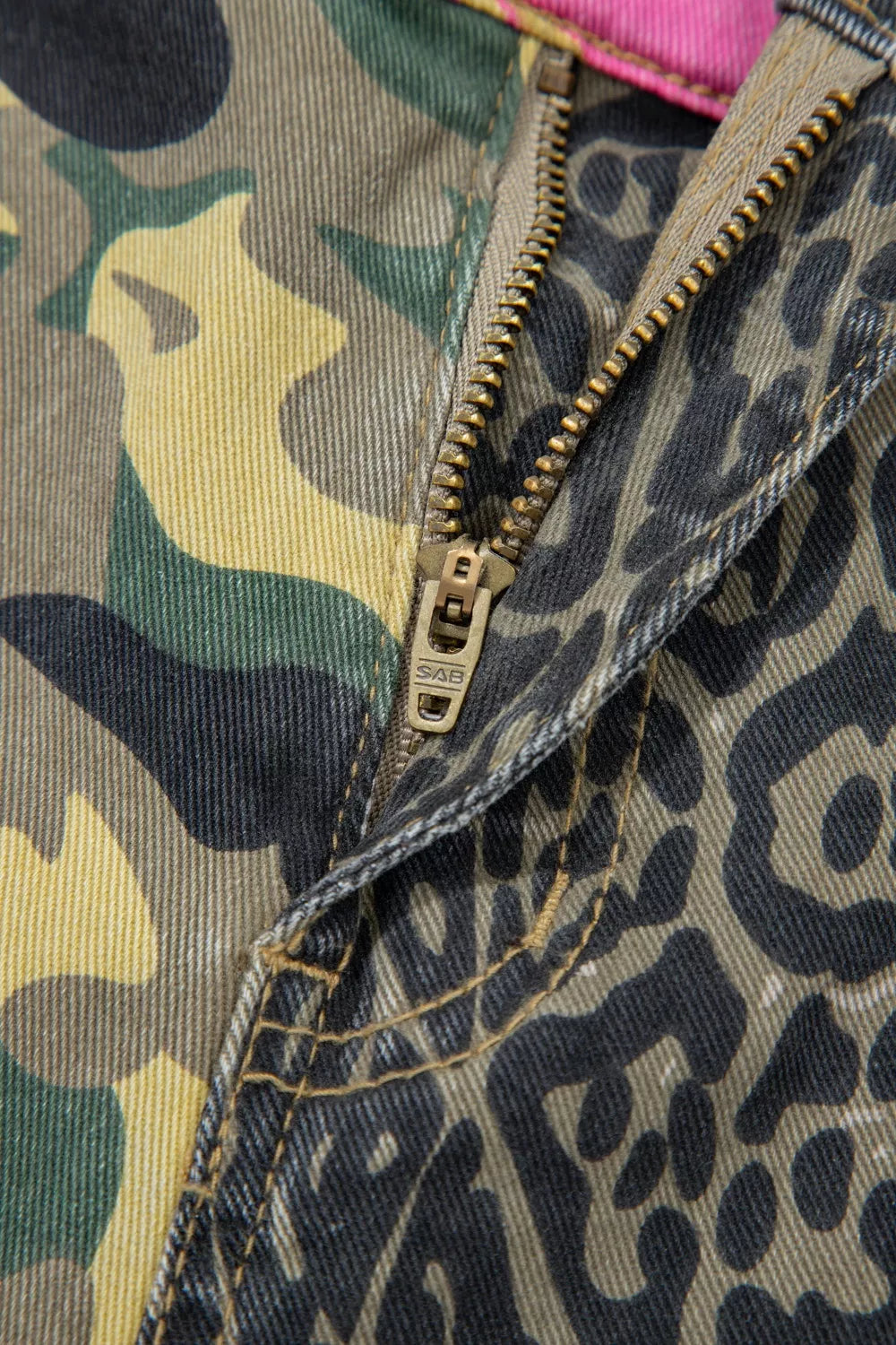 Waistband and pocket detail on patchwork denim