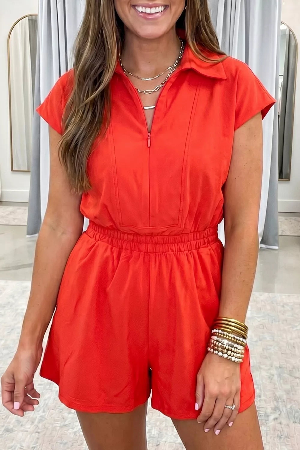 Half zip polo elastic waist romper front view in orange