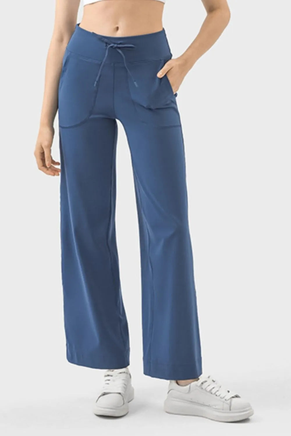 Drawstring active pants with pockets front view in dusty blue