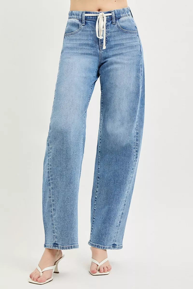 Side view of RISEN relaxed fit light wash jeans