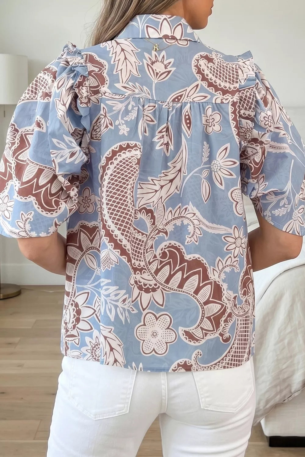 Floral button down short sleeve shirt on model
