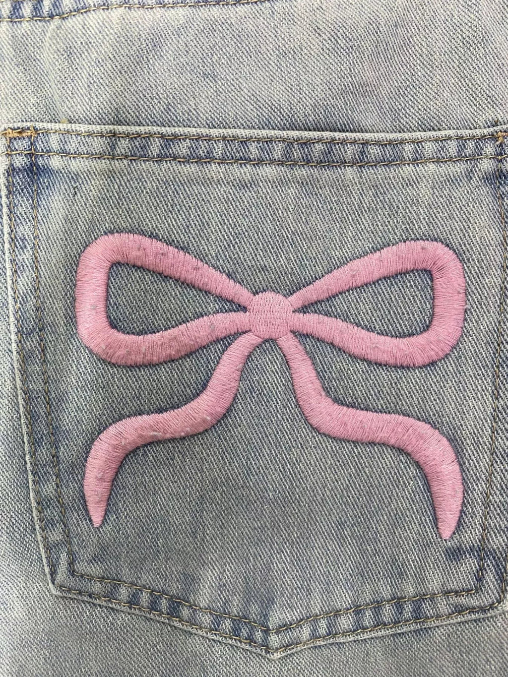 Light wash wide leg jeans styled full length view