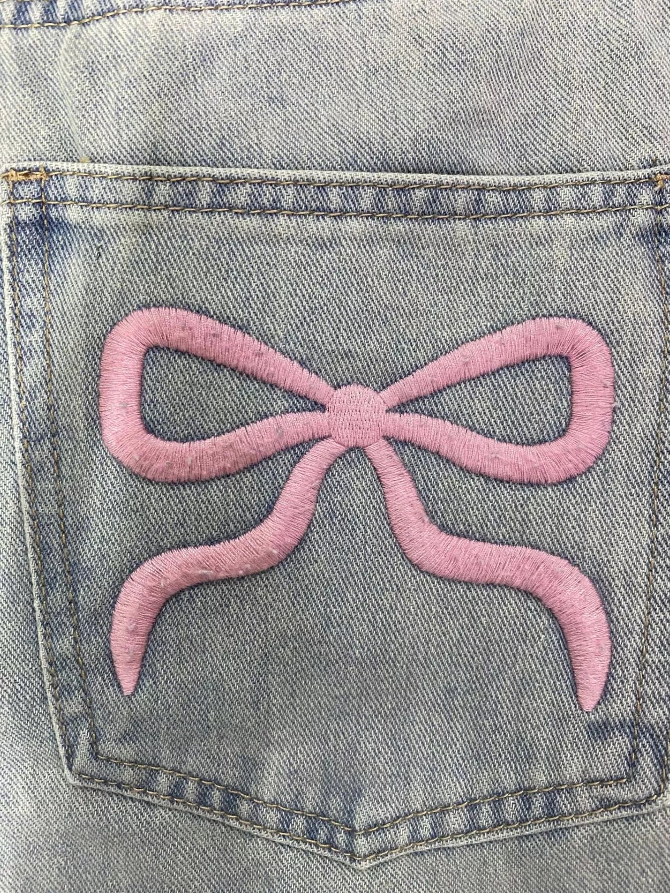 Light wash wide leg jeans styled full length view
