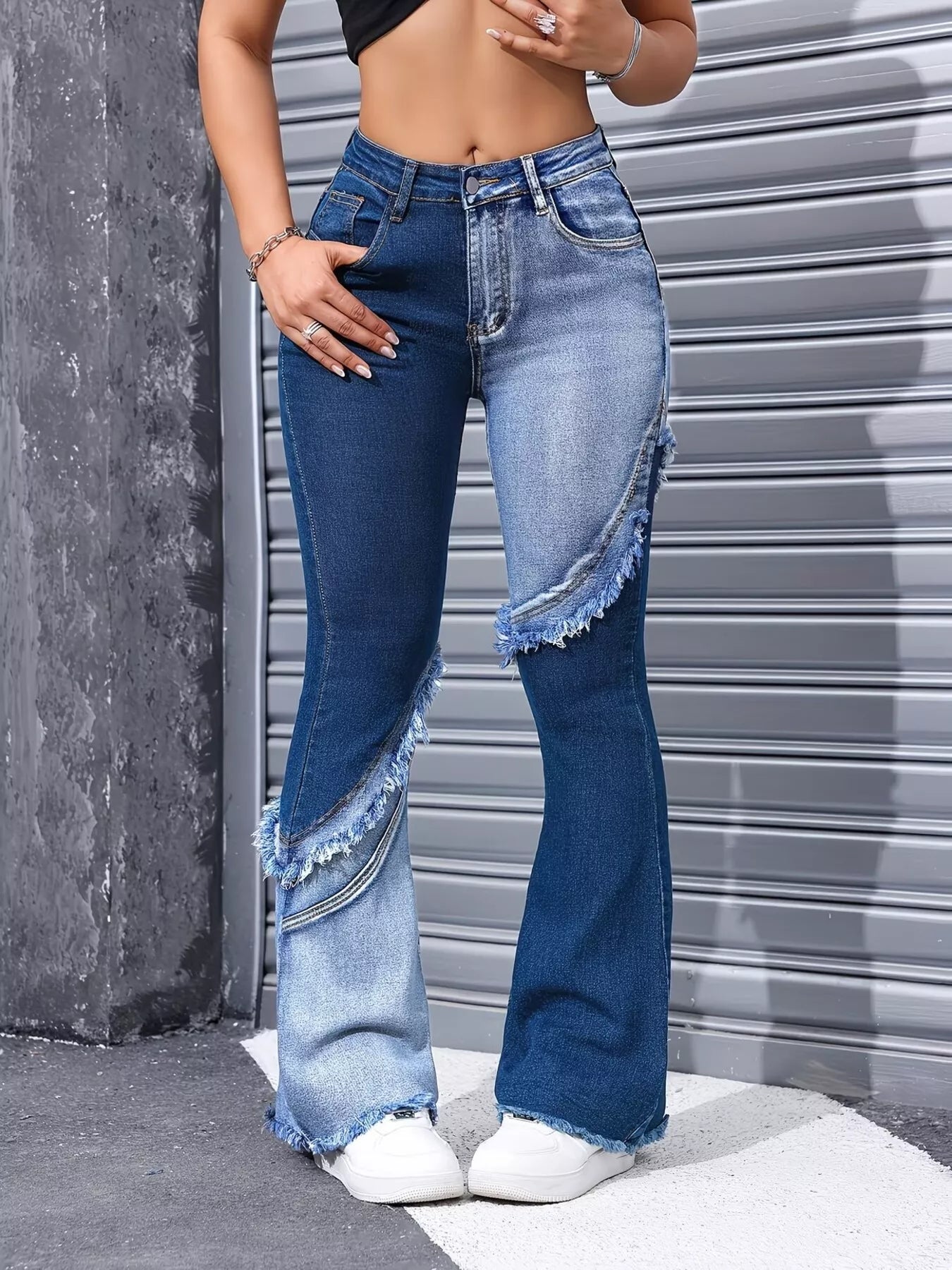 Model wearing two tone flare jeans styled outfit