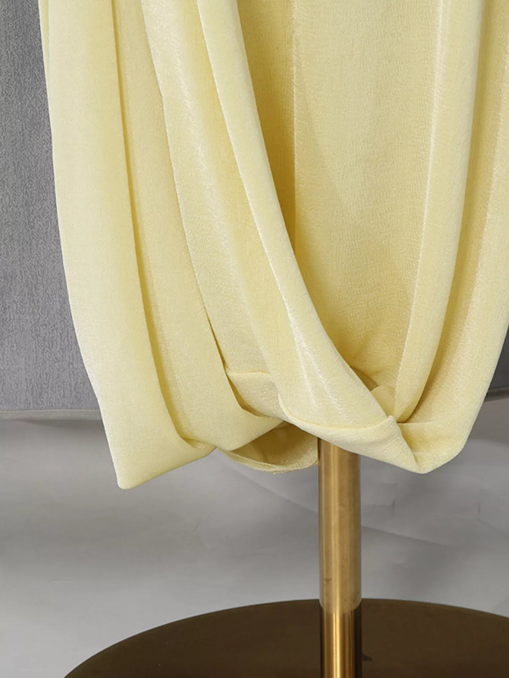 Model wearing yellow one shoulder maxi dress