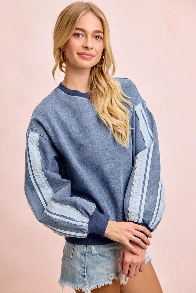 Denim lace sweatshirt sleeve detail close up