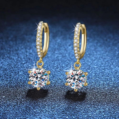 Rose gold moissanite drop earrings worn on model