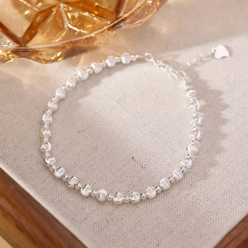 Silver beaded bracelet detail of polished beads