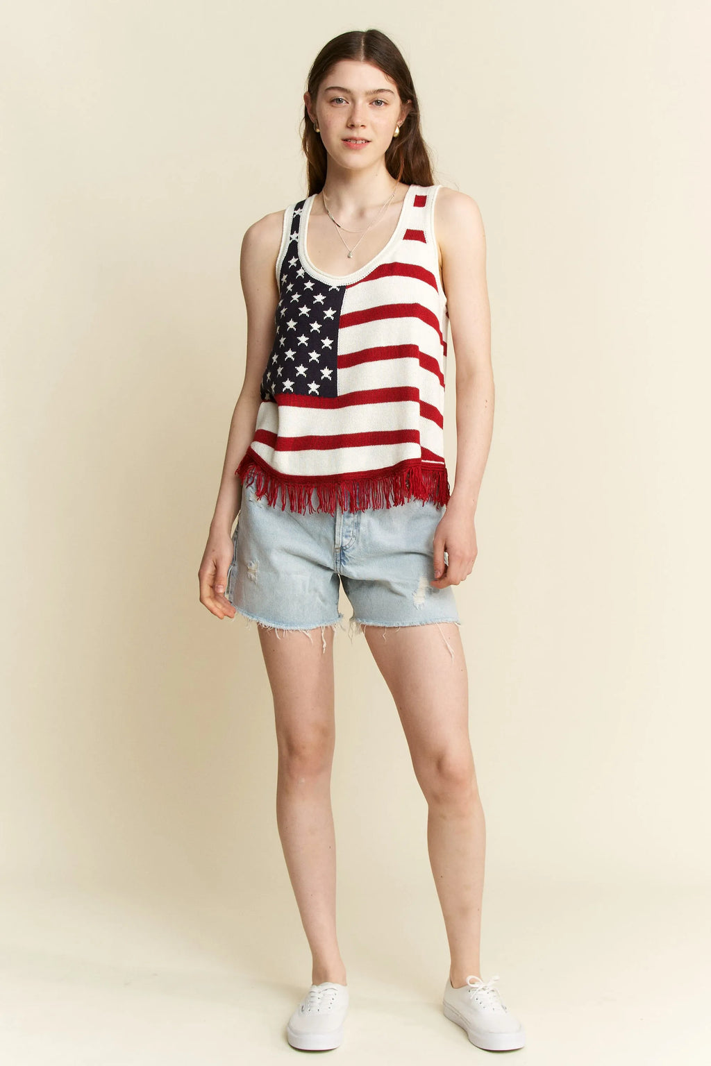 American flag tank top styled with denim shorts