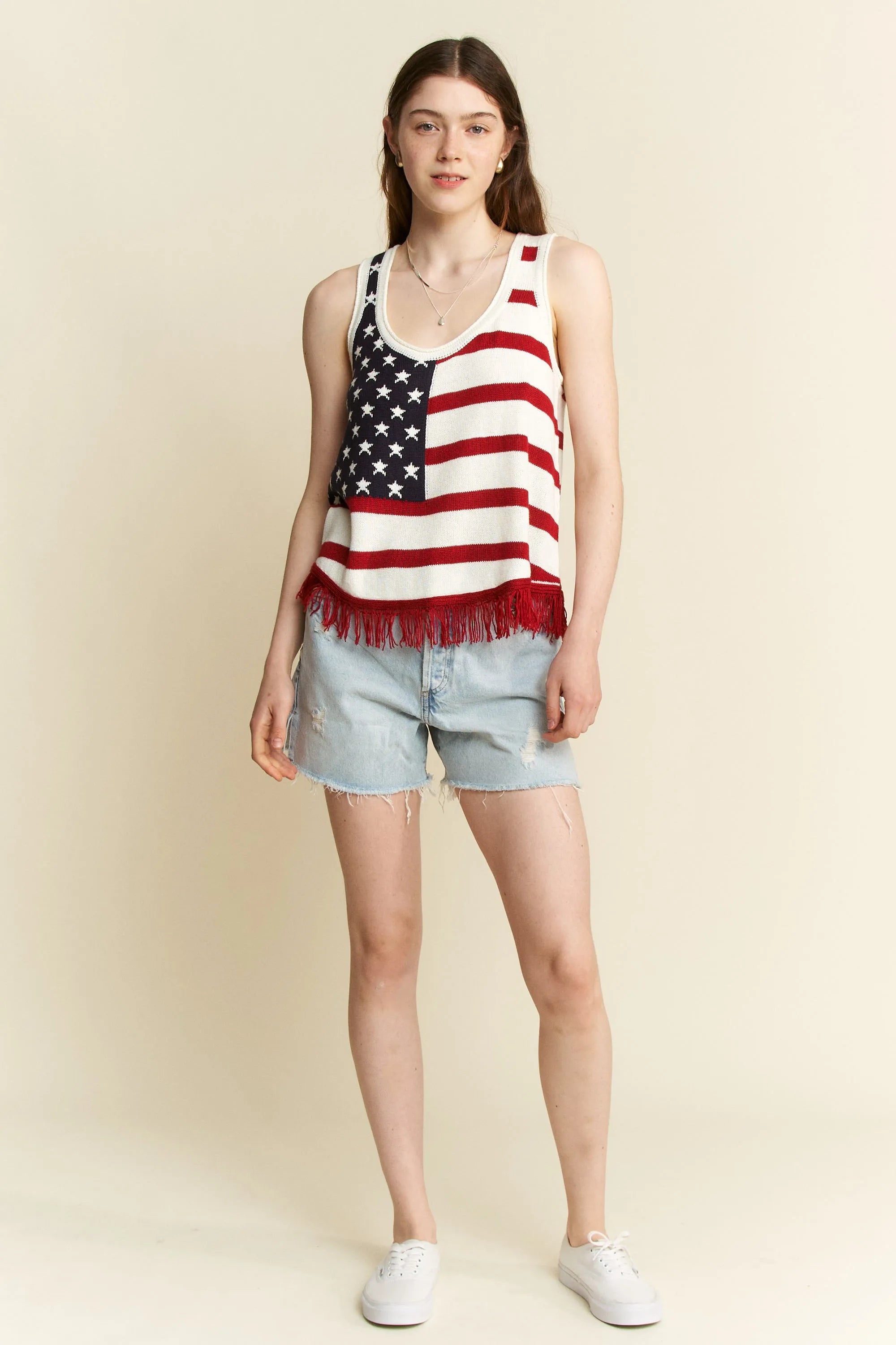 American flag tank top styled with denim shorts
