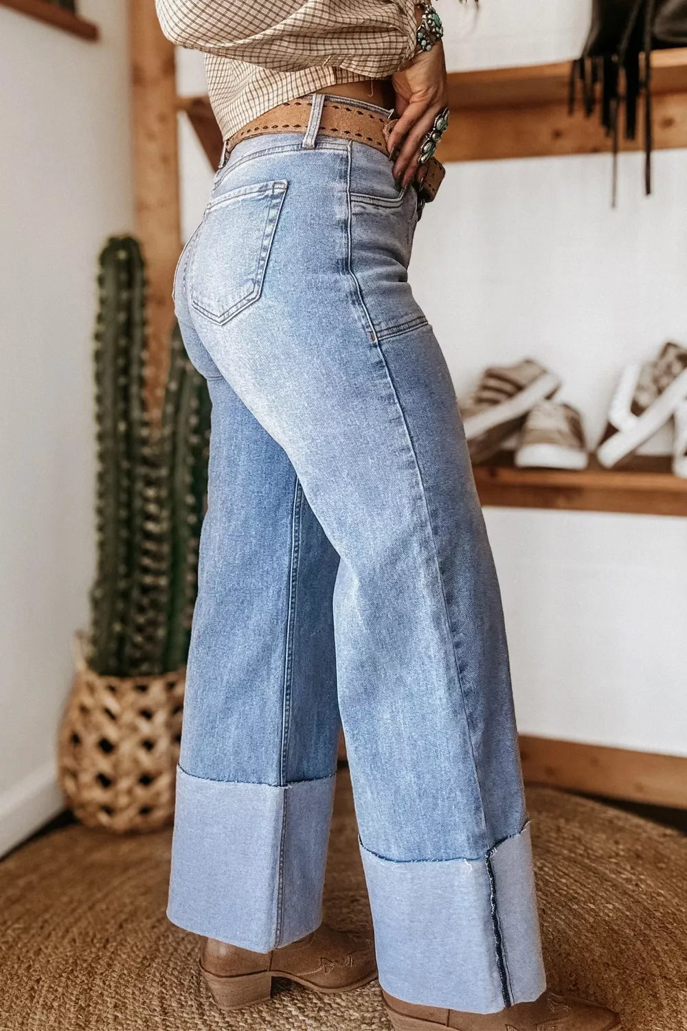 Woman wearing turn up cuff loose fit jeans