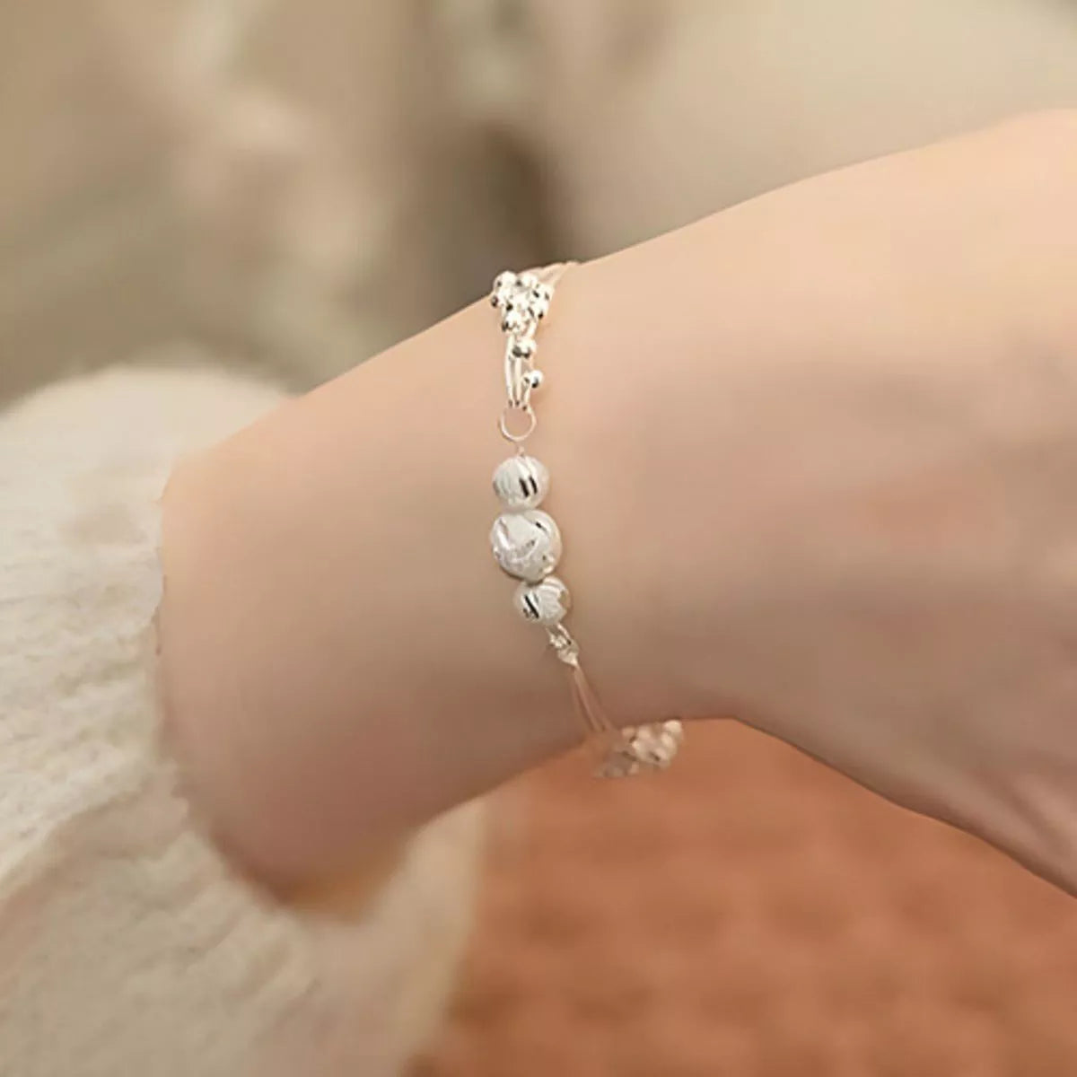 Silver bead chain bracelet clasp detail
