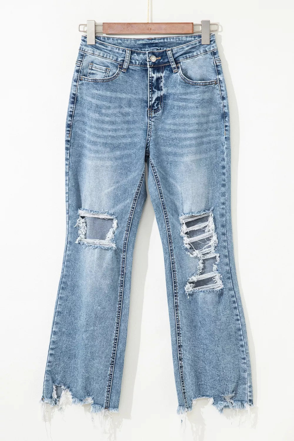 Open knee rip detail on flare jeans