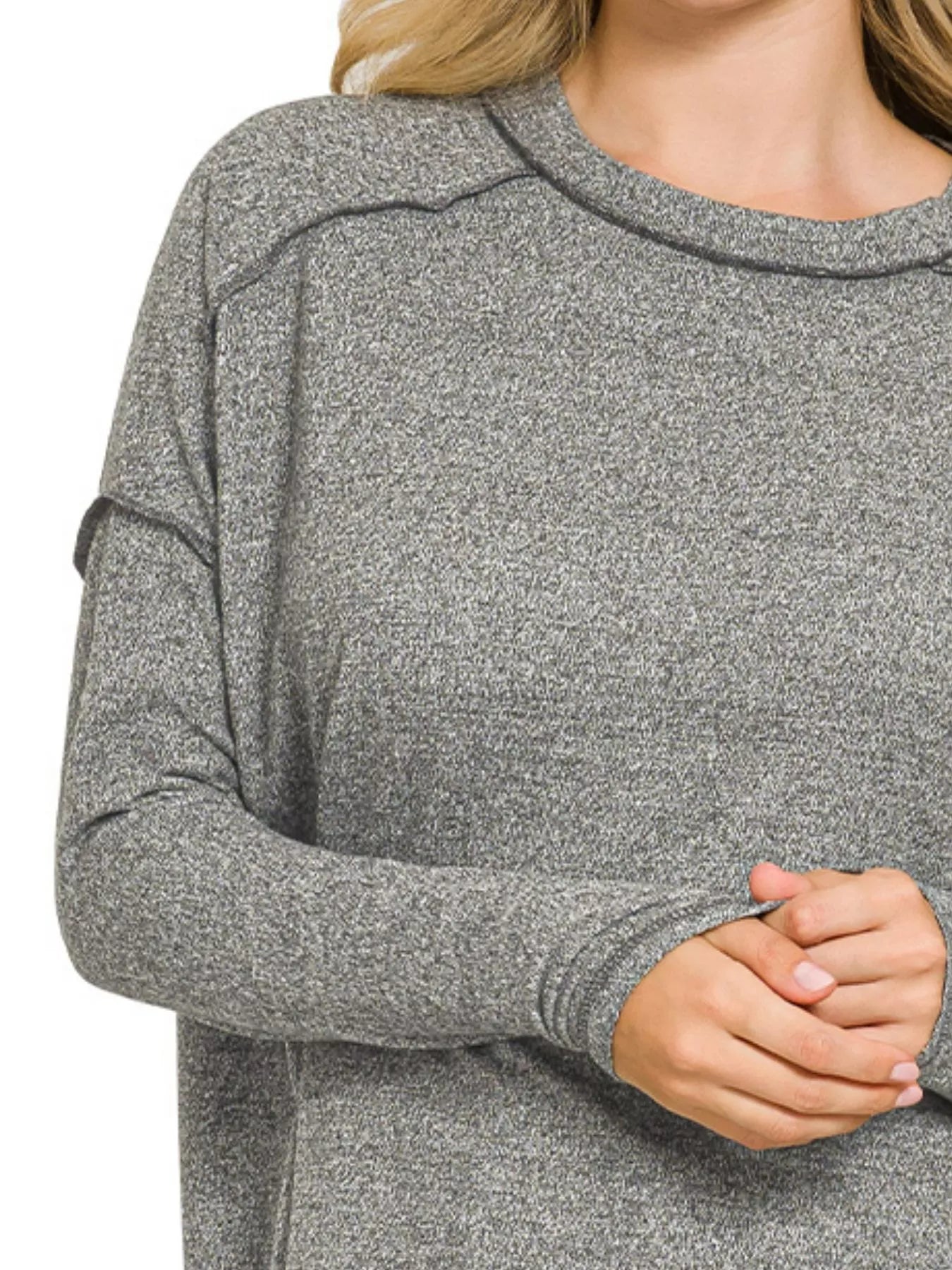 Plus size black hacci tee showing longer back hem detail