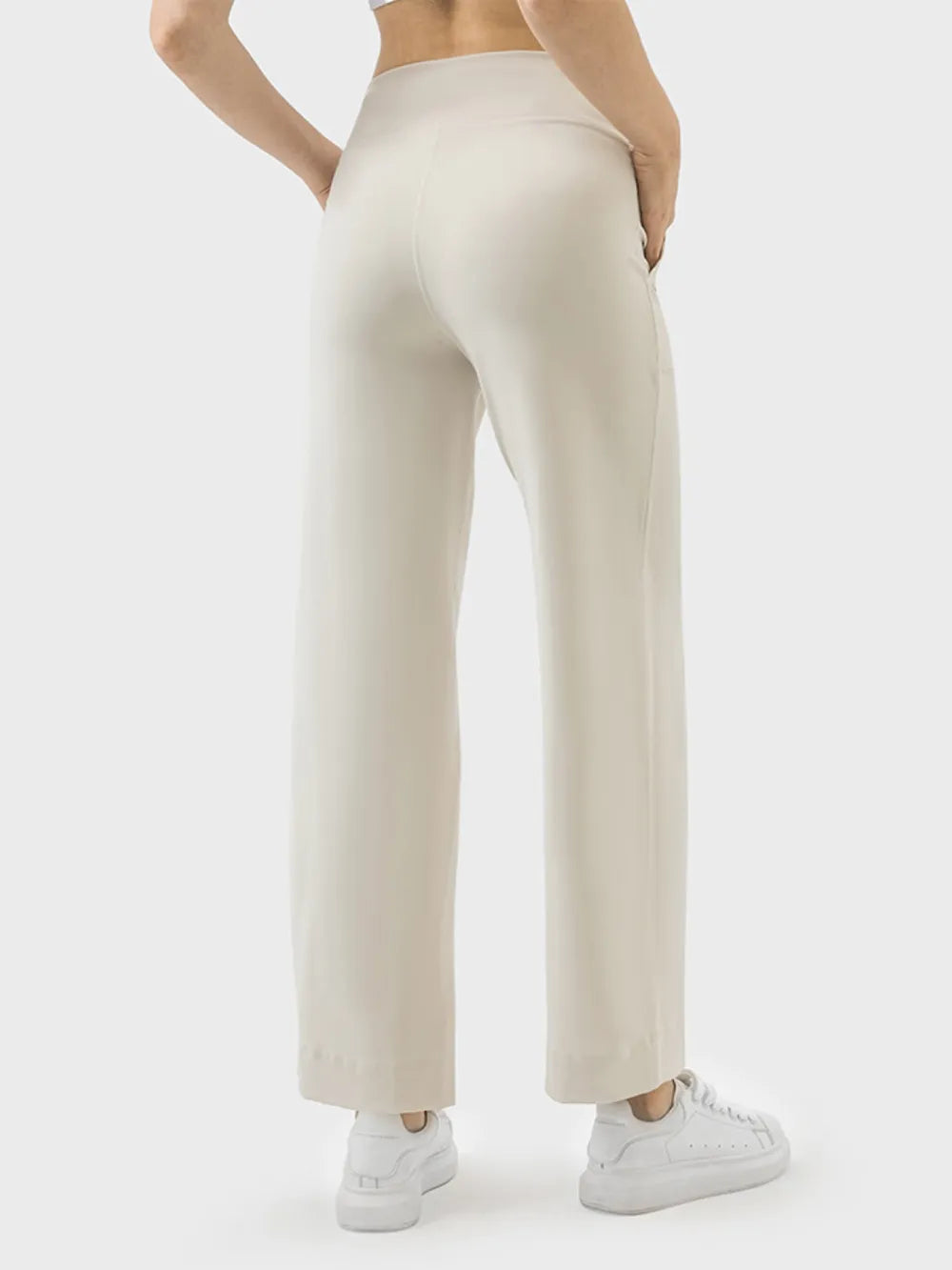 Cream active pants with pockets full length view