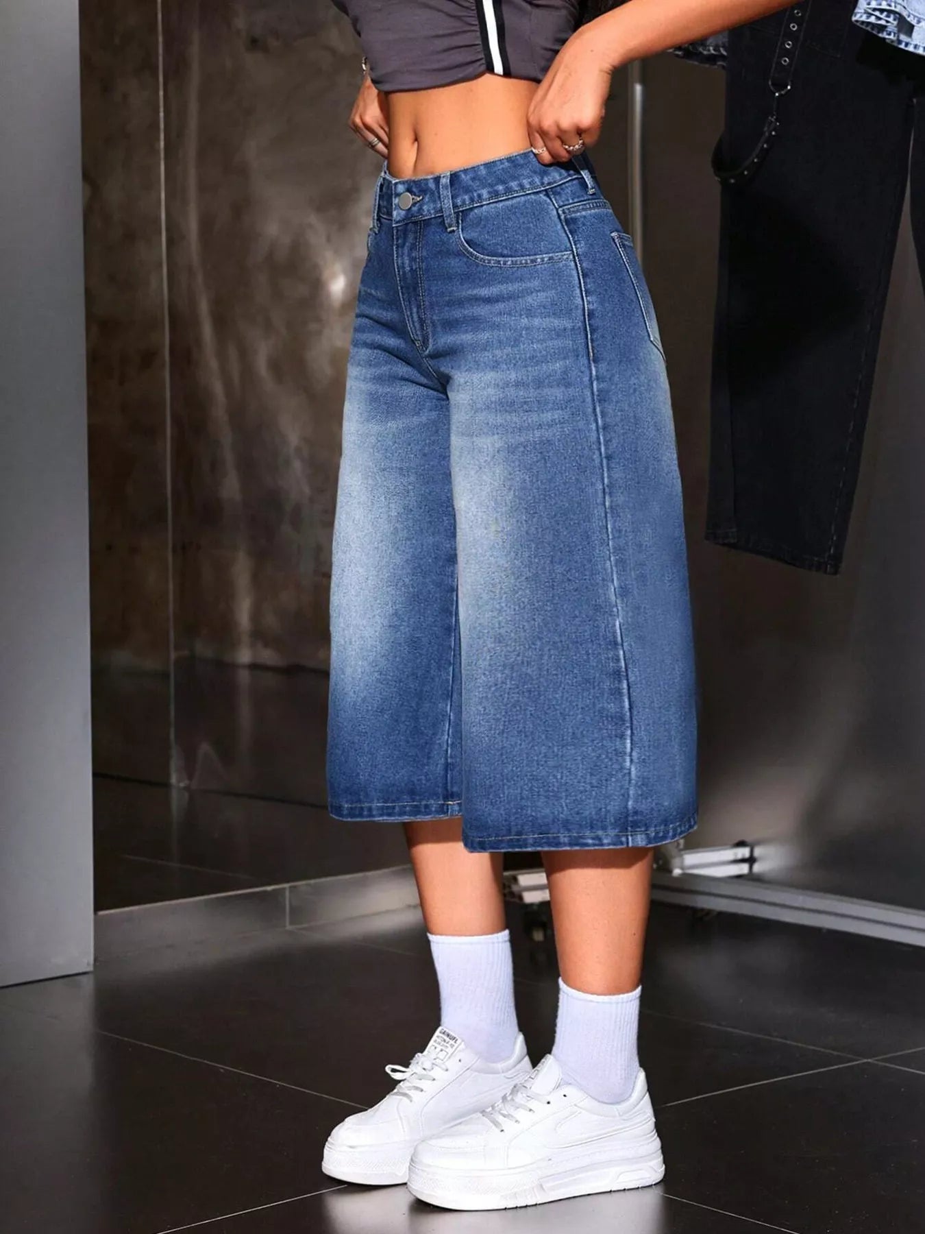 Blue wide leg denim capri jeans back view showing pockets