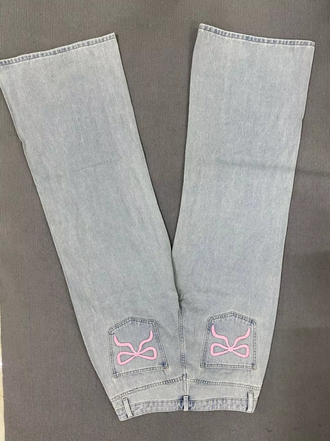 Model wearing light wash wide leg jeans casual outfit
