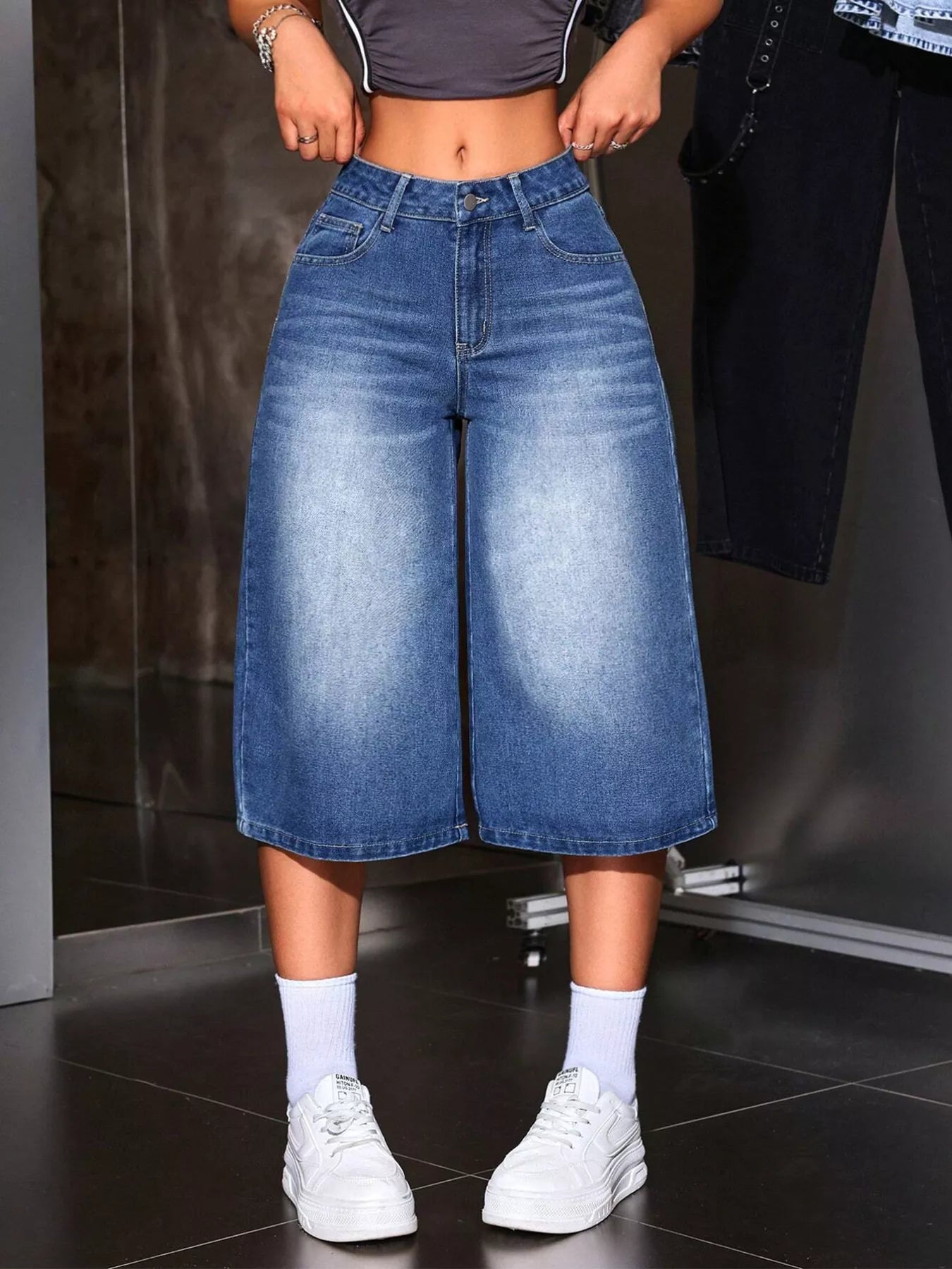 Blue wide leg denim capri jeans front view on model