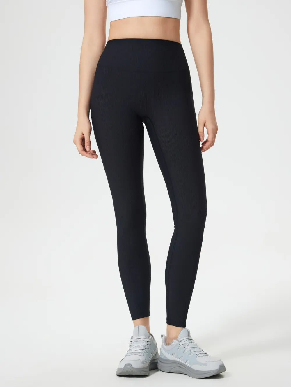 Model wearing high waist active leggings