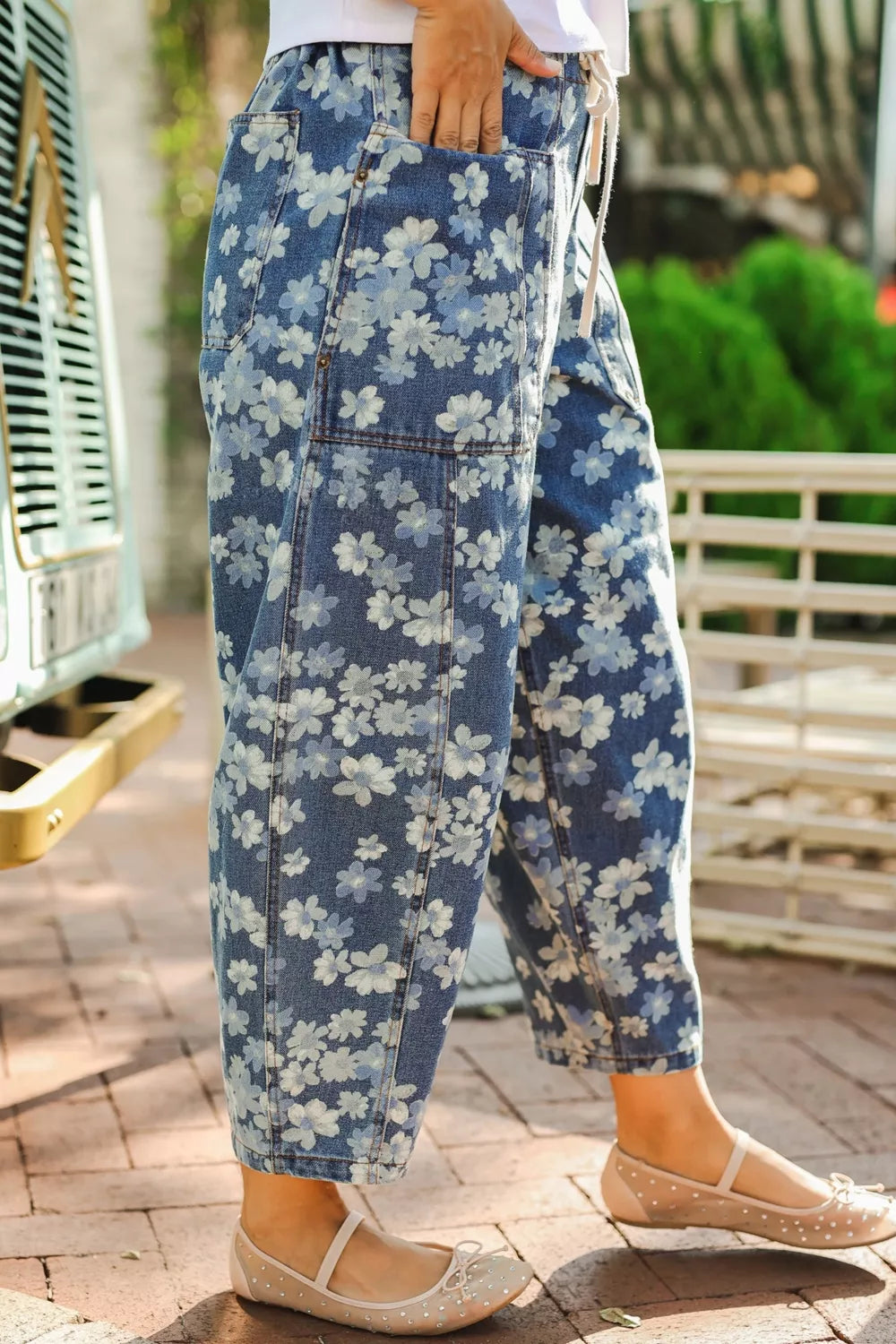 Floral print detail on dusty blue barrel jeans