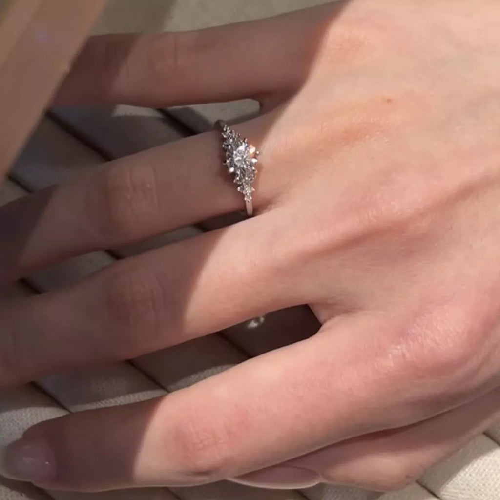 Moissanite ring shown on hand styled look