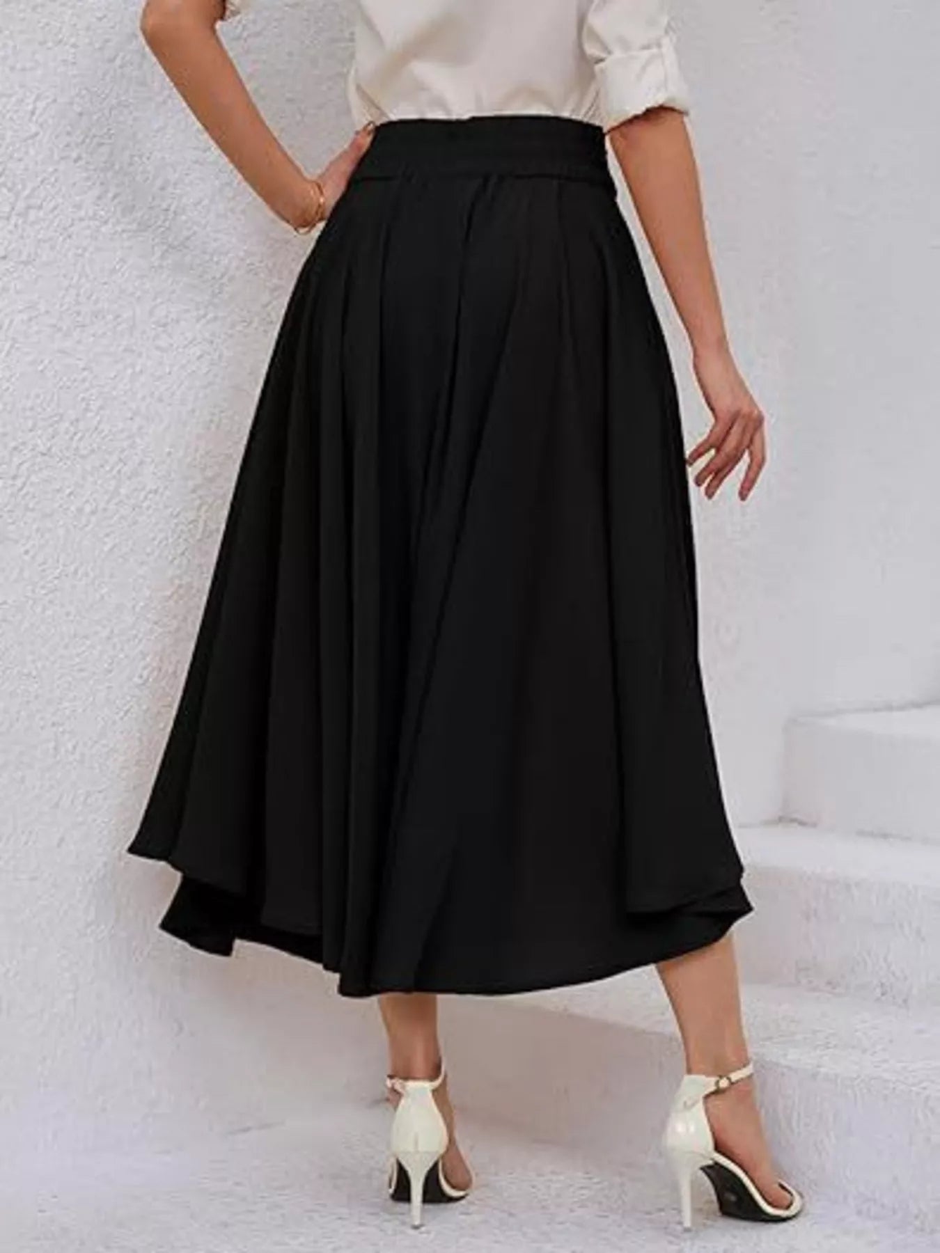 Black A line midi skirt back view on model