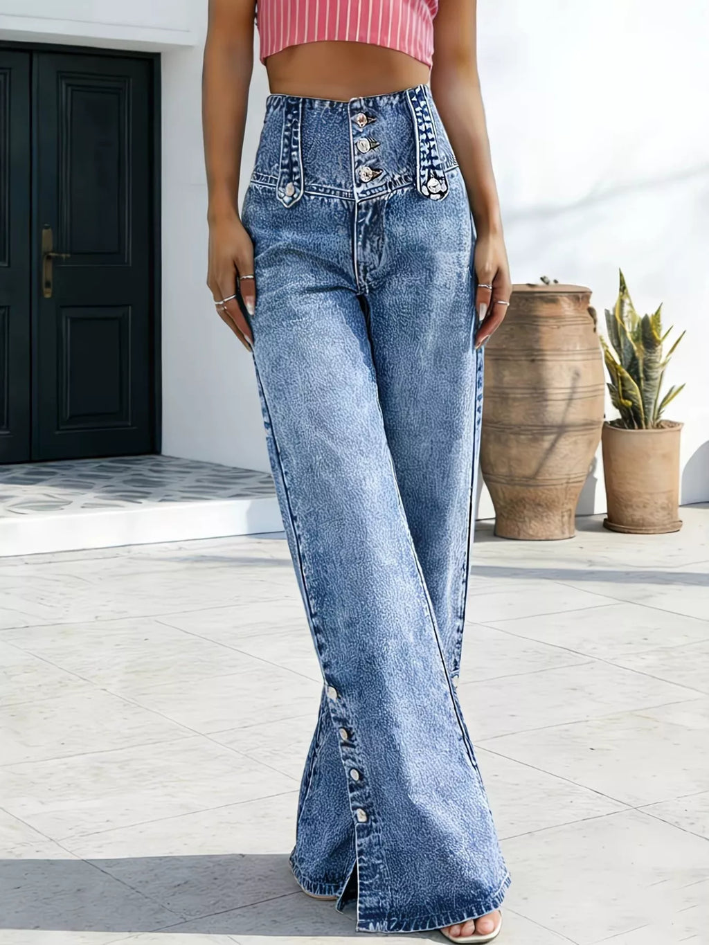 Model wearing high waisted wide leg jeans styled outfit
