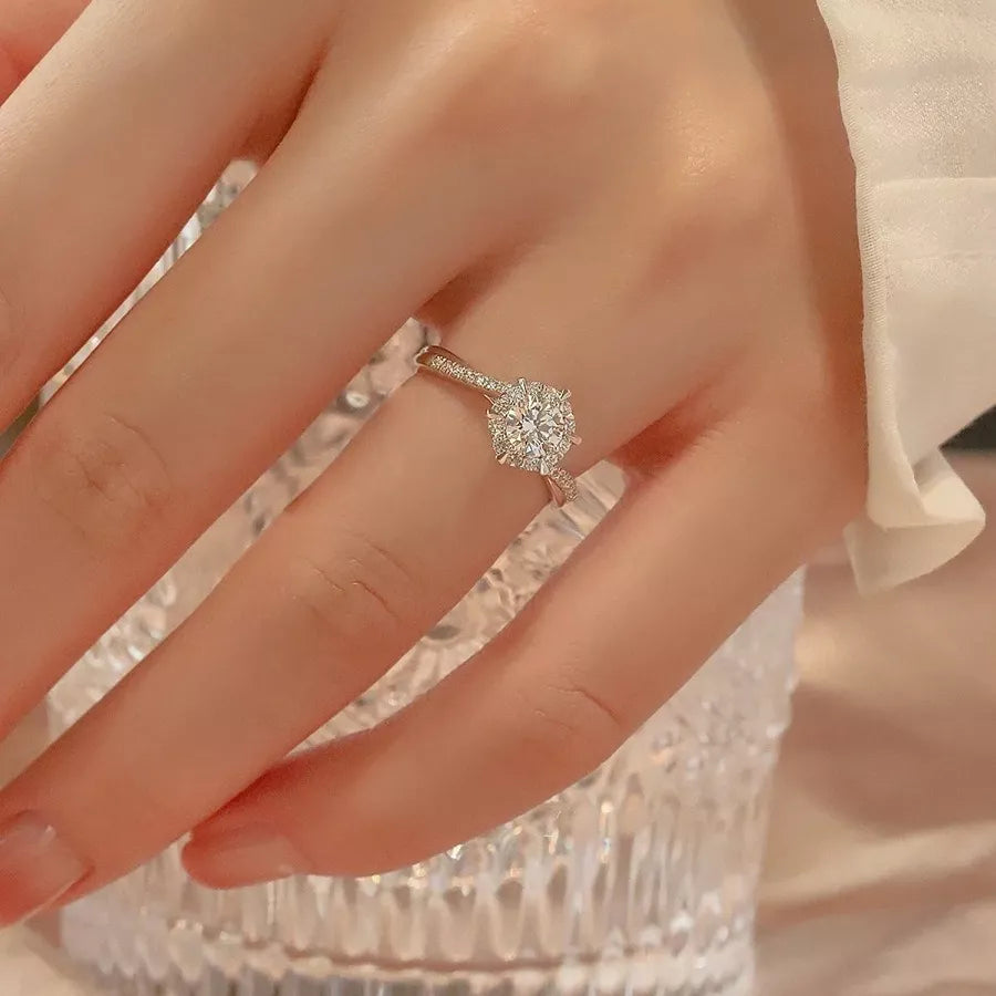 Moissanite ring shown on hand styled look
