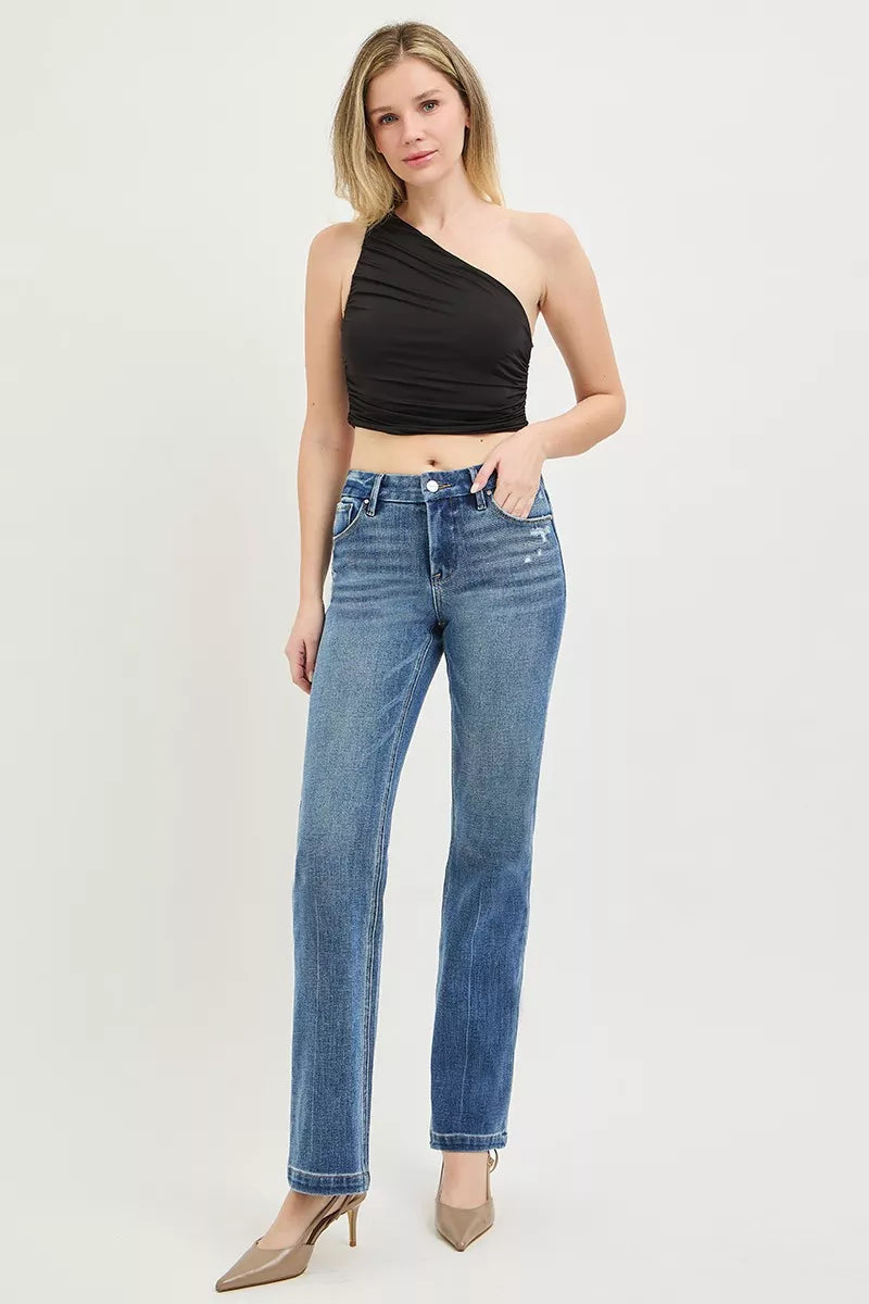 Medium wash denim detail on RISEN straight jeans