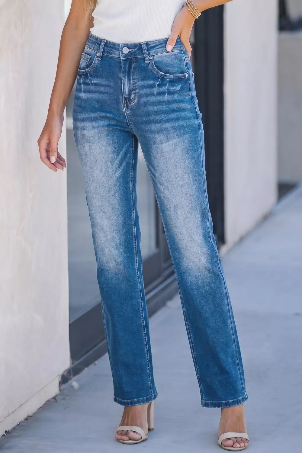 Model wearing acid wash straight leg jeans casual outfit