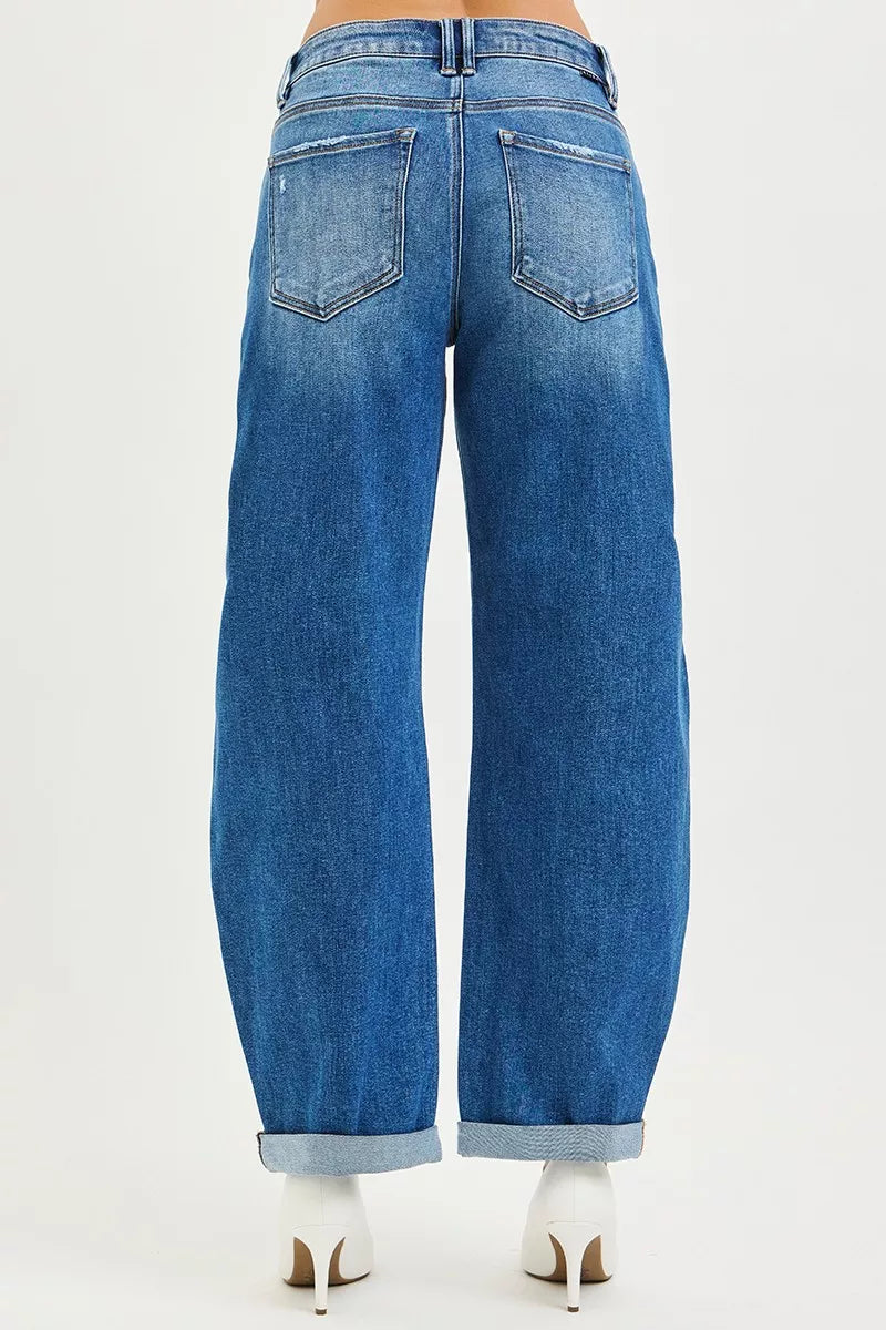 Model wearing RISEN barrel roll up jeans